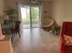 Peaceful Florida room with sliding doors opening to the backyard at 2219 Hawks Cove Cir, New Smyrna Beach, FL 32168