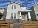 Two-story house with gray siding, stone accents, and a wooden fence at 5318 Center Lake Ranch Blvd, Saint Cloud, FL 34771