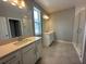 Bright bathroom with double vanities and a glass-enclosed shower at 5318 Center Lake Ranch Blvd, St Cloud, FL 34771