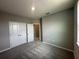 Neutral bedroom with closet, gray carpeting and gray walls and an open doorway at 5318 Center Lake Ranch Blvd, St Cloud, FL 34771
