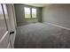 Spacious bedroom with plush carpeting and natural light from two windows at 5318 Center Lake Ranch Blvd, St Cloud, FL 34771