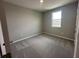 Cozy bedroom featuring plush carpeting, a neutral color scheme, and a bright window at 5318 Center Lake Ranch Blvd, St Cloud, FL 34771
