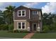 Charming two-story home with brick walkway, manicured landscaping, and a welcoming front porch at 5318 Center Lake Ranch Blvd, St Cloud, FL 34771