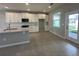 Well-lit kitchen with white cabinets, stainless steel appliances, stone countertops, and breakfast nook at 5318 Center Lake Ranch Blvd, St Cloud, FL 34771
