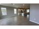 Open-concept kitchen with island, white cabinets, tile floors and stainless steel appliances at 5318 Center Lake Ranch Blvd, St Cloud, FL 34771