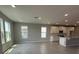 Bright living area features large windows that fill the space with natural light, highlighting the neutral color palette at 5318 Center Lake Ranch Blvd, St Cloud, FL 34771