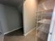 Walk-in pantry with metal shelving and tiled floor at 5318 Center Lake Ranch Blvd, St Cloud, FL 34771