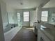 Elegant bathroom with double vanity, soaking tub, and glass-enclosed shower at 5379 Park Guell St, St Cloud, FL 34771