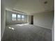 Spacious carpeted bedroom with bright natural light from several windows at 5379 Park Guell St, St Cloud, FL 34771