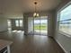 Dining area featuring sliding glass doors that open to the backyard at 5379 Park Guell St, St Cloud, FL 34771