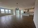 Spacious living room with hardwood floors and sliding glass doors at 5379 Park Guell St, St Cloud, FL 34771