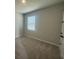 Neutral bedroom features carpet, neutral paint and natural light at 5379 Park Guell St, St Cloud, FL 34771