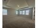 Large primary bedroom with tray ceiling and plenty of natural light at 5379 Park Guell St, St Cloud, FL 34771