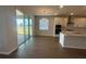 Bright dining area boasts wood floors, modern lighting, and sliding doors to the outdoors at 5379 Park Guell St, St Cloud, FL 34771