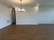 Bright and open living area featuring modern lighting and stylish flooring, creating an inviting atmosphere at 5379 Park Guell St, St Cloud, FL 34771