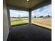 Covered patio features brick flooring and overlooks a scenic outdoor space with a sidewalk at 5379 Park Guell St, St Cloud, FL 34771