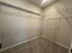 Walk-in closet features built-in shelving and carpet at 5379 Park Guell St, St Cloud, FL 34771