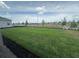 Expansive backyard featuring lush green grass and professional landscaping, perfect for outdoor activities at 5385 Park Guell St, St Cloud, FL 34771