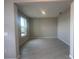 Flex room with a large window and tile floors, offering versatile space for living at 5385 Park Guell St, St Cloud, FL 34771