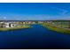 New homes in a serene community with lakefront views and lush landscaping at 7916 Waterfield Ave, Orlando, FL 32832