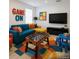 Fun game room with foosball table, colorful seating, and a playful design providing entertainment space at 7916 Waterfield Ave, Orlando, FL 32832