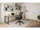 Sleek home office with a modern desk, ergonomic chair, floating shelves, and contemporary decor providing a workspace at 7916 Waterfield Ave, Orlando, FL 32832