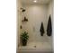 Modern shower with glass enclosure, rainfall showerhead, and stylish shelving for a spa-like experience at 7916 Waterfield Ave, Orlando, FL 32832