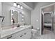 Bathroom with vanity, toilet, and access to bedroom at 799 Palmetto Ter, Oviedo, FL 32765