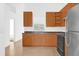 Bright kitchen featuring ample wood cabinets and stainless steel appliances at 916 Derbyshire Dr, Kissimmee, FL 34758