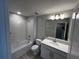 Clean and bright bathroom with a tub, shower, and a modern vanity at 5086 Rain Shadow Dr, St Cloud, FL 34772