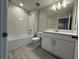 Well-lit bathroom with modern fixtures and a spacious vanity at 5086 Rain Shadow Dr, St Cloud, FL 34772