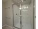 Bathroom shower enclosure with subway tile and modern hardware at 5086 Rain Shadow Dr, St Cloud, FL 34772