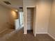 Upstairs bedroom features neutral carpet, a walk-in closet, and natural light at 5086 Rain Shadow Dr, St Cloud, FL 34772