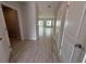 Hallway with tile floors provides access to rooms of the home at 5086 Rain Shadow Dr, St Cloud, FL 34772