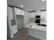 Modern kitchen with sleek countertops, white cabinets, stainless steel appliances, and a functional island at 5086 Rain Shadow Dr, St Cloud, FL 34772