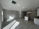 Open-concept living space with tile flooring, recessed lighting, and seamlessly connected kitchen at 5086 Rain Shadow Dr, St Cloud, FL 34772