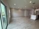 Open-concept living room with hardwood floors and lots of natural light and open layout at 5086 Rain Shadow Dr, St Cloud, FL 34772