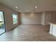 Spacious open-concept living area with hardwood floors and lots of natural light at 5086 Rain Shadow Dr, St Cloud, FL 34772