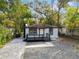 Newly renovated home with a modern deck and landscaped yard at 101 S Glenwood Ave, Orlando, FL 32803