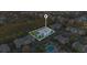 Aerial view highlights a building with solar panels, surrounded by lush greenery and community amenities at 12843 Madison Pointe Cir # 107, Orlando, FL 32821
