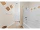 Bright bathroom with a white tile shower-tub combo at 12843 Madison Pointe Cir # 107, Orlando, FL 32821