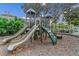 Community playground area with slide and climbing wall at 12843 Madison Pointe Cir # 107, Orlando, FL 32821