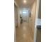 Open hallway with neutral tile floors and a view of the front door at 2243 Tay Wes Dr, Saint Cloud, FL 34771