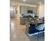 Modern kitchen with island, granite countertops, and stainless steel appliances at 2243 Tay Wes Dr, Saint Cloud, FL 34771