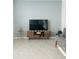 Cozy living room featuring light gray walls, tile flooring, and contemporary decor at 2243 Tay Wes Dr, Saint Cloud, FL 34771