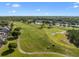 Golf course community with lush fairways, water features, and homes at 9918 Turtle Bay Ct, Orlando, FL 32832