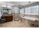 Bathroom with tub and shower, granite countertops at 9918 Turtle Bay Ct, Orlando, FL 32832