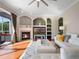 A living room with a fireplace and built-in shelving, providing a cozy and organized space at 9918 Turtle Bay Ct, Orlando, FL 32832