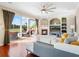 Living room featuring hardwood floors, a fireplace, and a view of the backyard at 9918 Turtle Bay Ct, Orlando, FL 32832