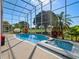 Screened pool and spa with lush landscaping and golf course views at 9918 Turtle Bay Ct, Orlando, FL 32832